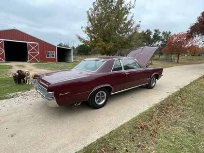 1965 Pontiac GTO, rear three-quarter view with hood open