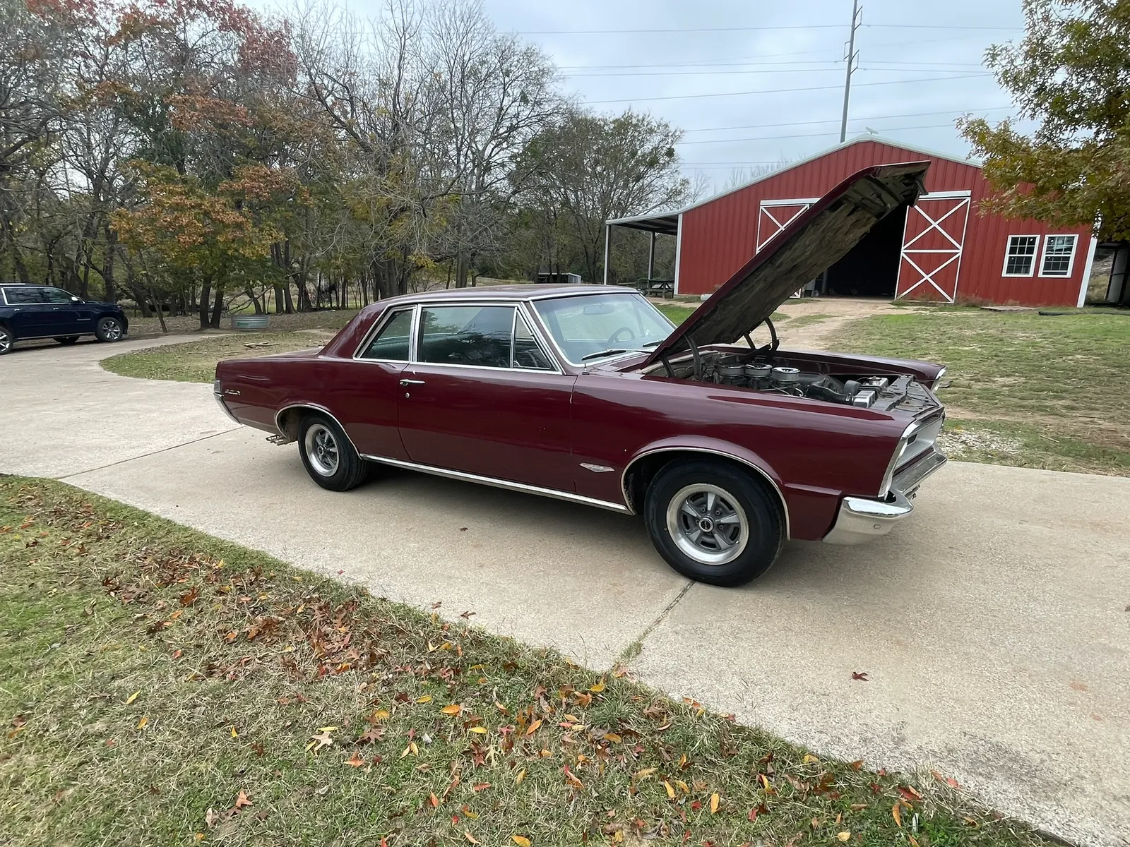 1965 Pontiac GTO, side view with hood open